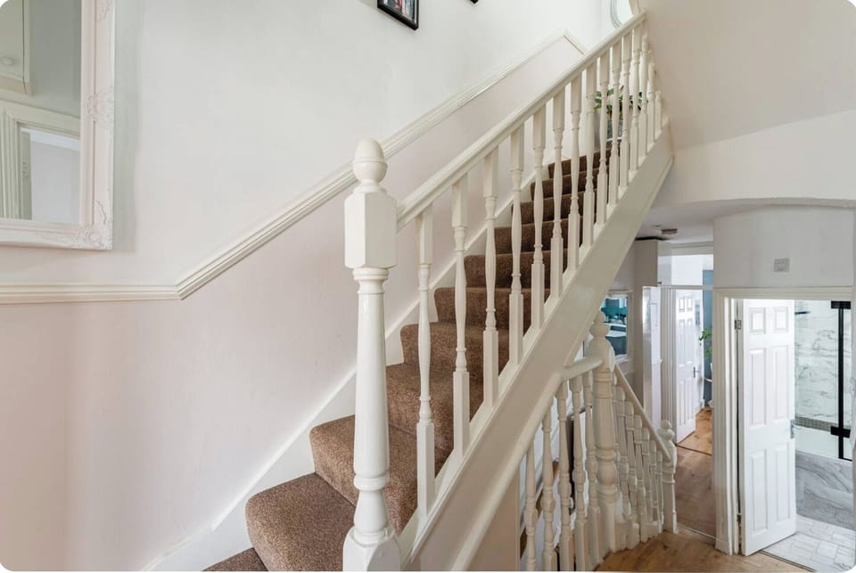 Stairs + handrail to next floor