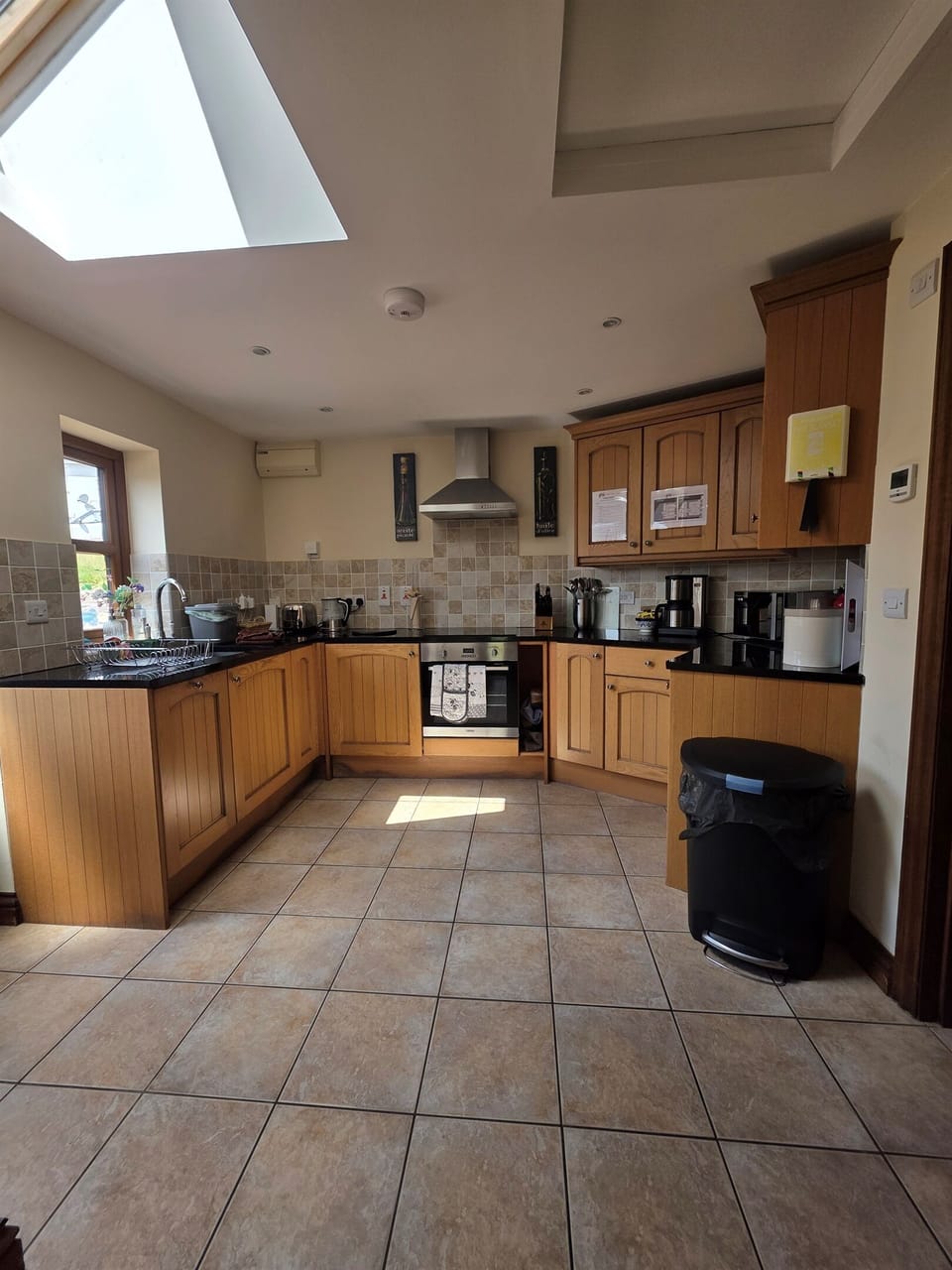 Fully equipped kitchen including: induction hob & oven, drinks station, microwave, dishwasher, toaster, small fridge/freezer (with a standard fridge by the stairs in the lounge).