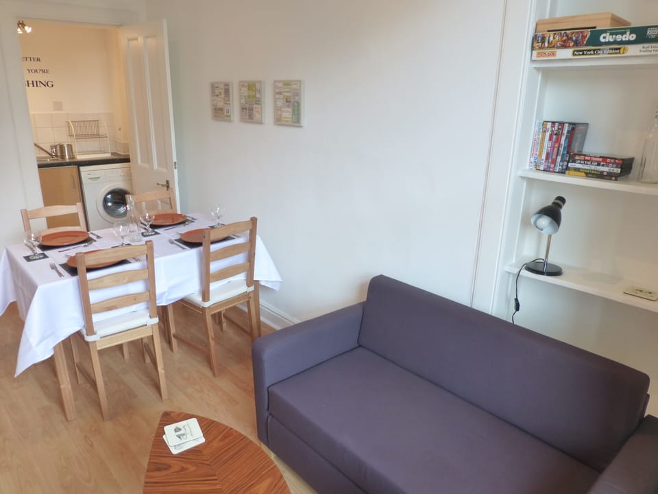 The dining area with a view of the utility room