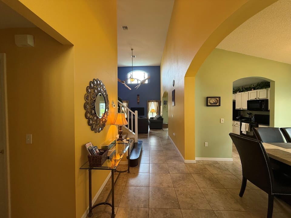 The spacious hallway leads to the ground floor suites and family areas.