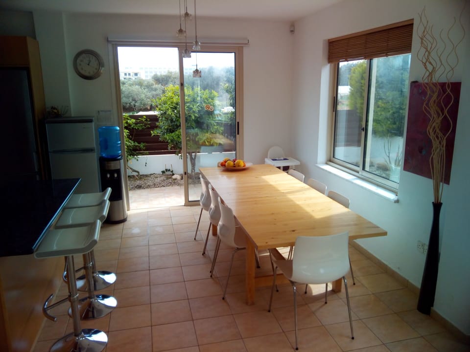 Large dining table and black granite breakfast bar