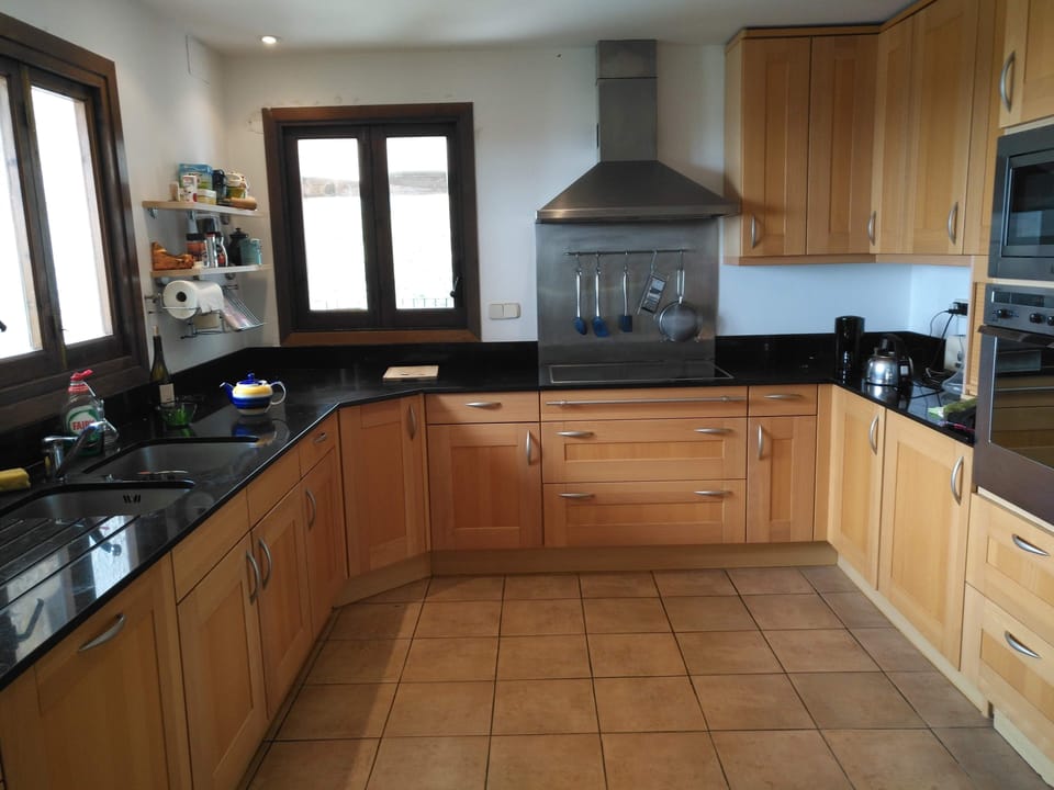Kitchen with dishwasher. Utility room has washing machine & dryer