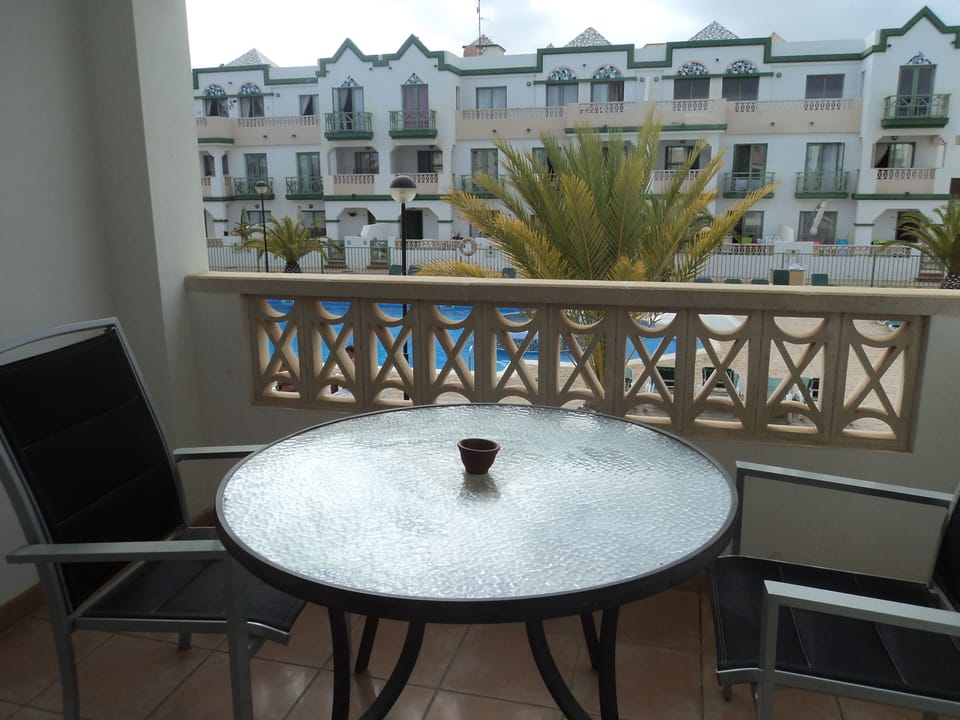 Master bedroom balcony overlooking the pool area.