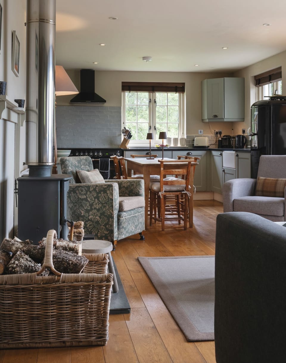 Cosy open plan Living room and kitchen. French doors looking out to the Loch.