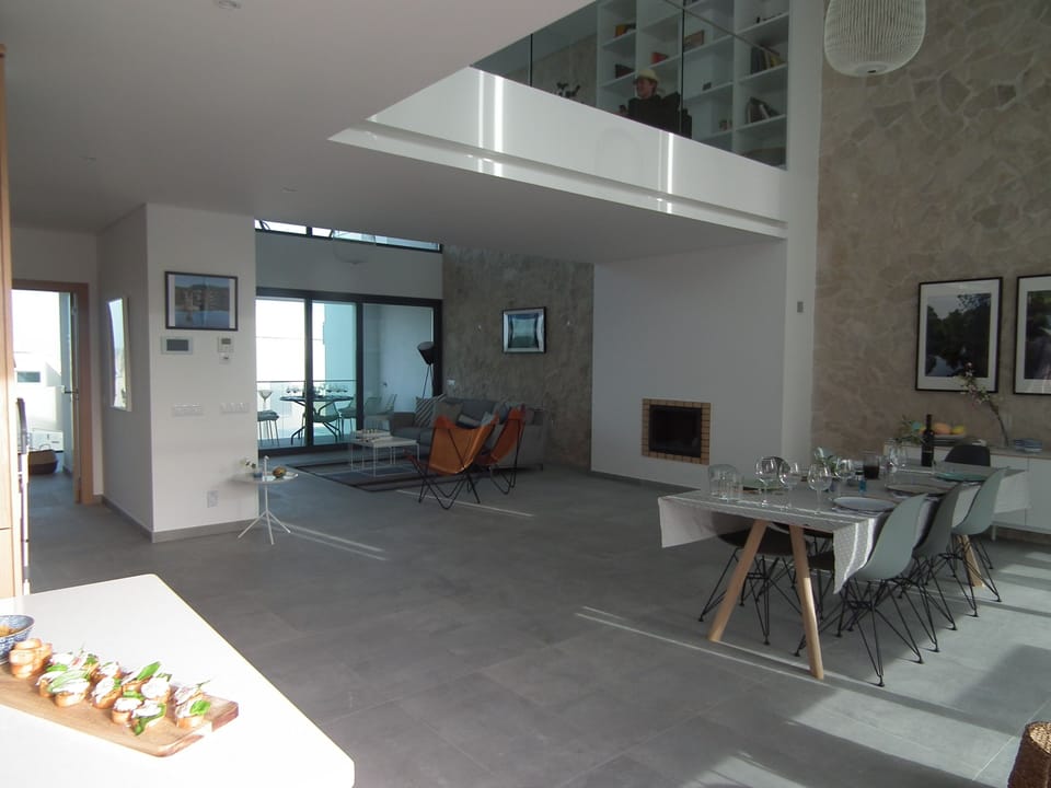 lounge and dining area With double ceiling and elevated walkway