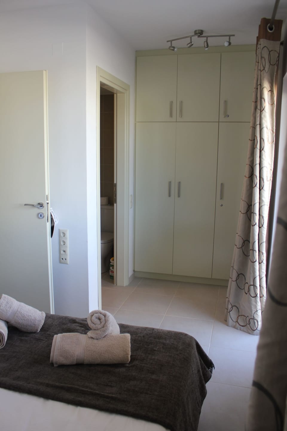 Master bedroom with wardrobes, ensuite and door to terrace complete with air con