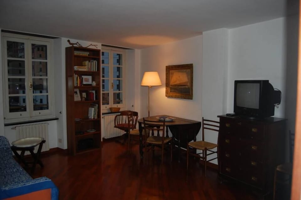 The living room in the evening with views of marina