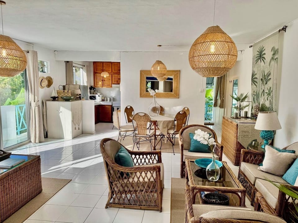 Air-conditioned,spacious living/dining room- showing balcony,kitchen & entrance 