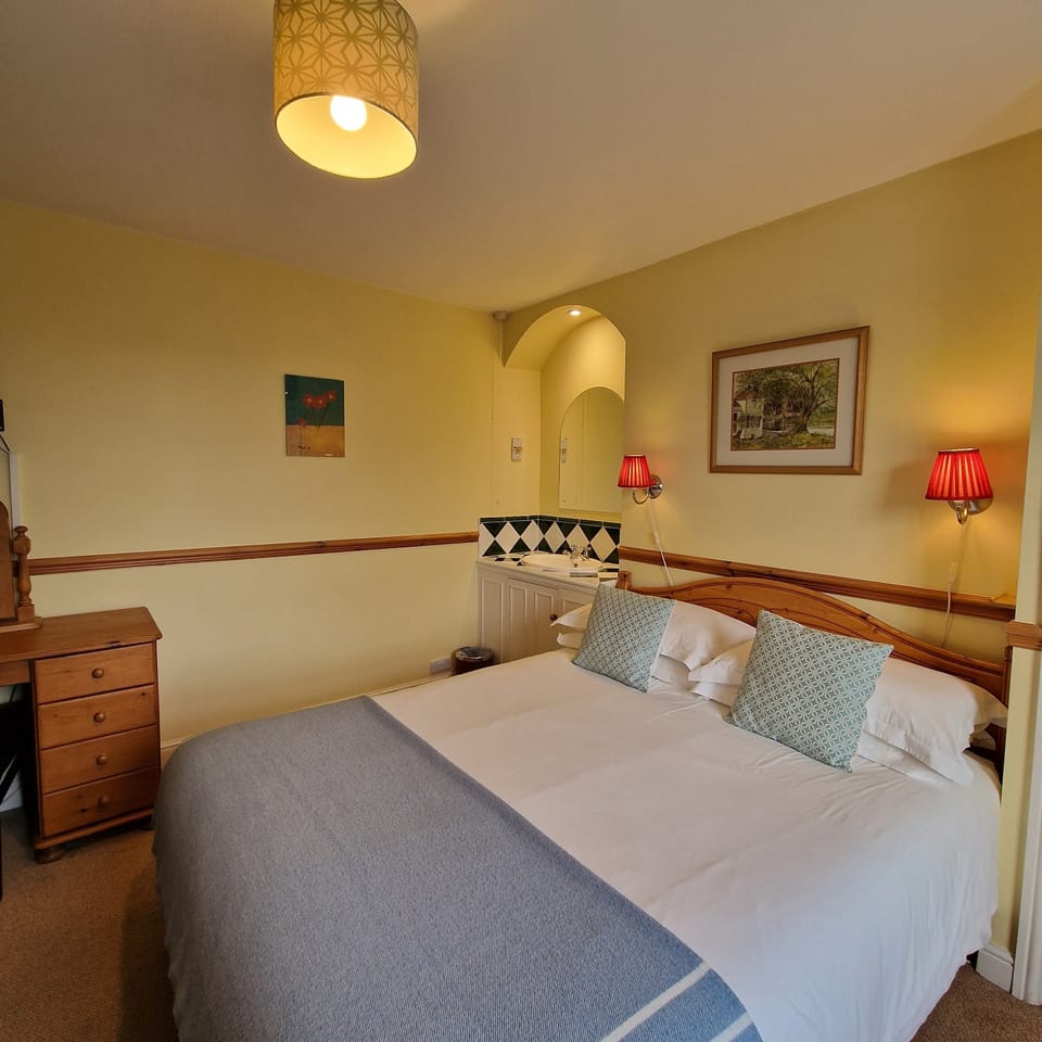 Family bedroom with double bed and bunk beds 