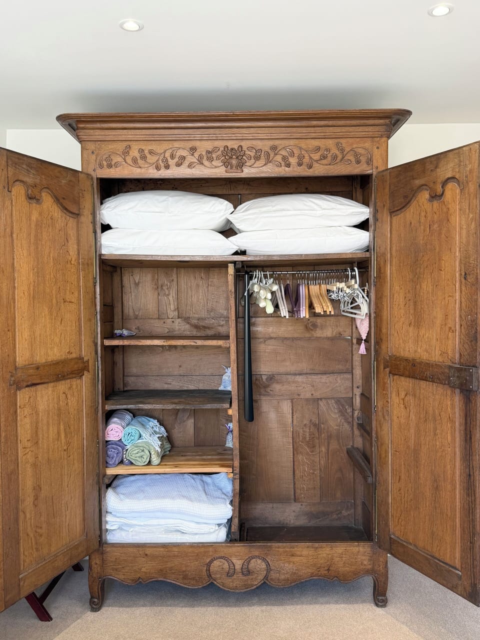 Large armoire to hang your clothes or to get extra pillows/blankets...