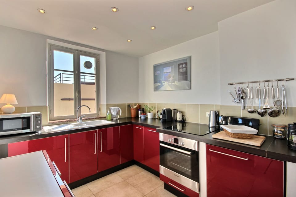 Kitchen with oven, cooker, microwave, fridge/freezer, dishwasher, washer/dryer. 