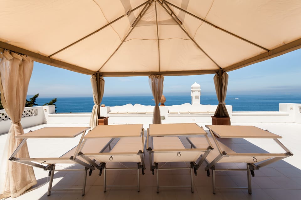 Large solarium overlooking Capri and the bay of Naples; sunbeds, shower, seaview