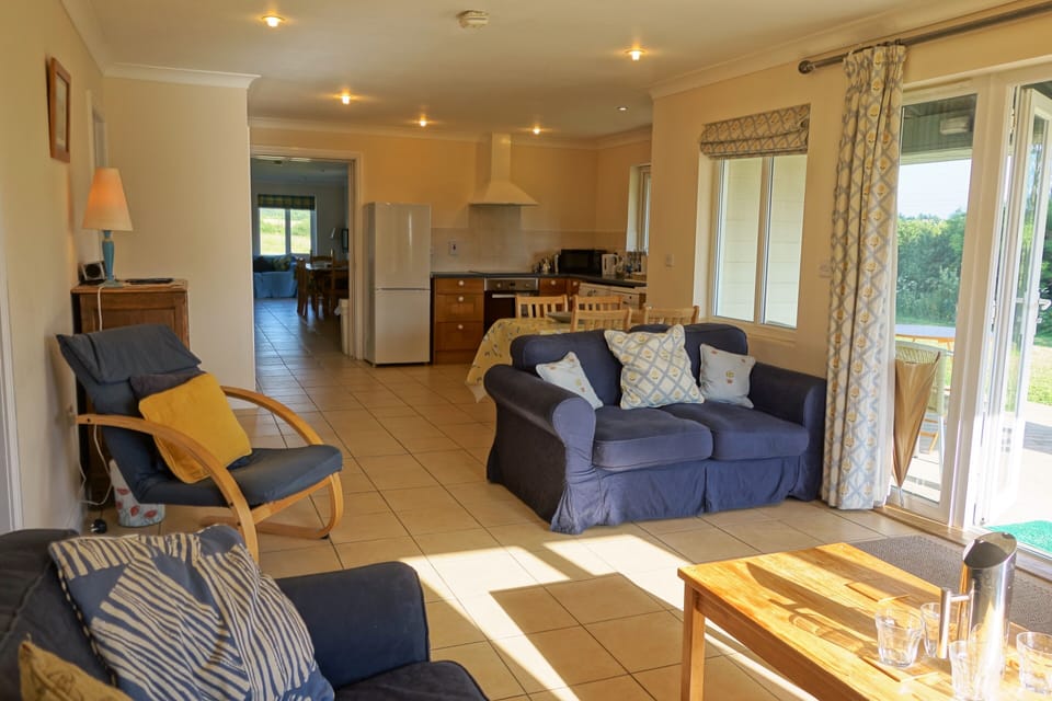 Russet living room with doors to verandah, dining and kitchen, thru to Pippin 
