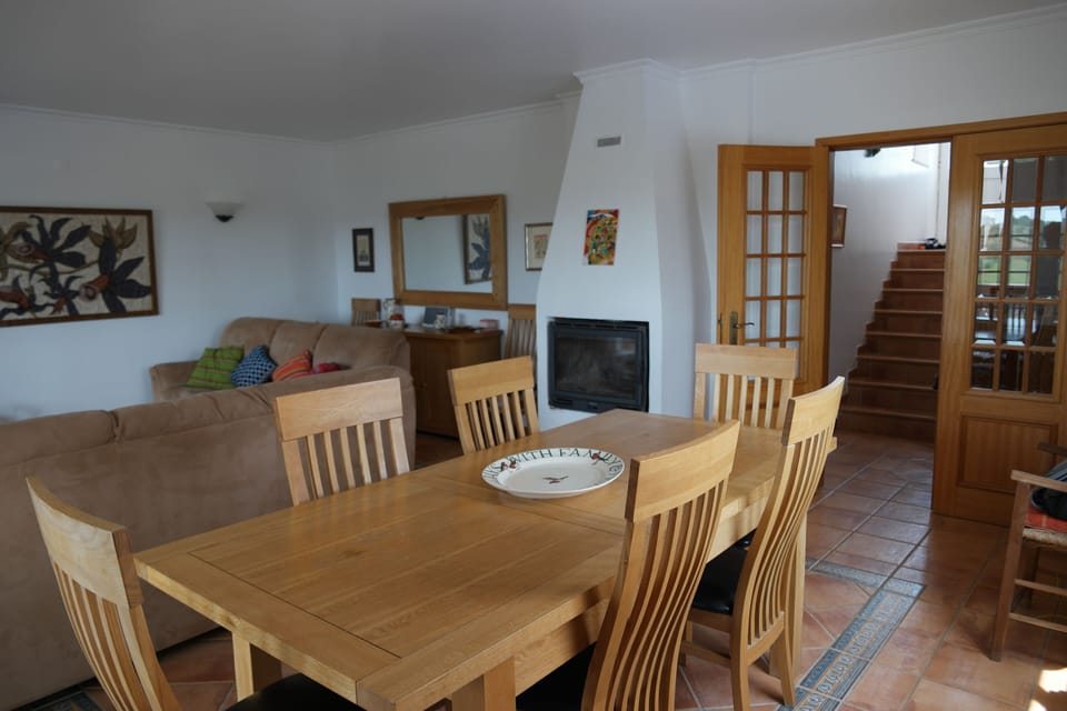 Living room, which has kitchen next door and stairs to bedroom 1.