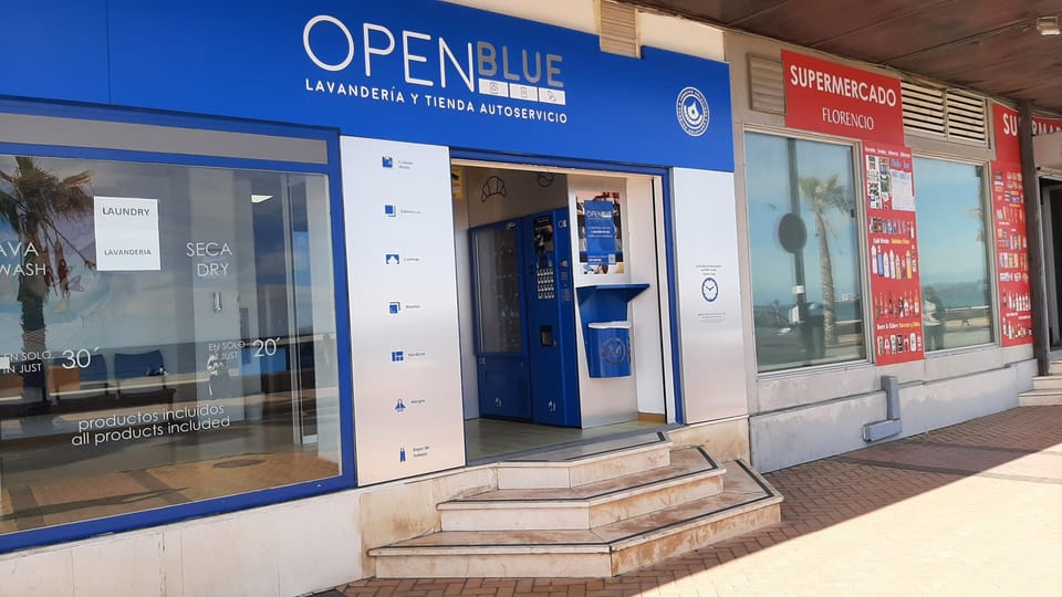 Street entrance to the Laundry Facility and Local mini Supermarket next door. 