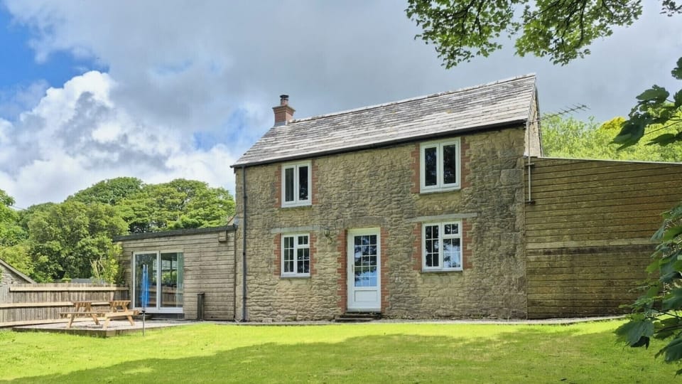 Back of house with a fully enclosed rear garden 