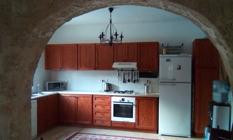 Fully equipped kitchen with water cooler.