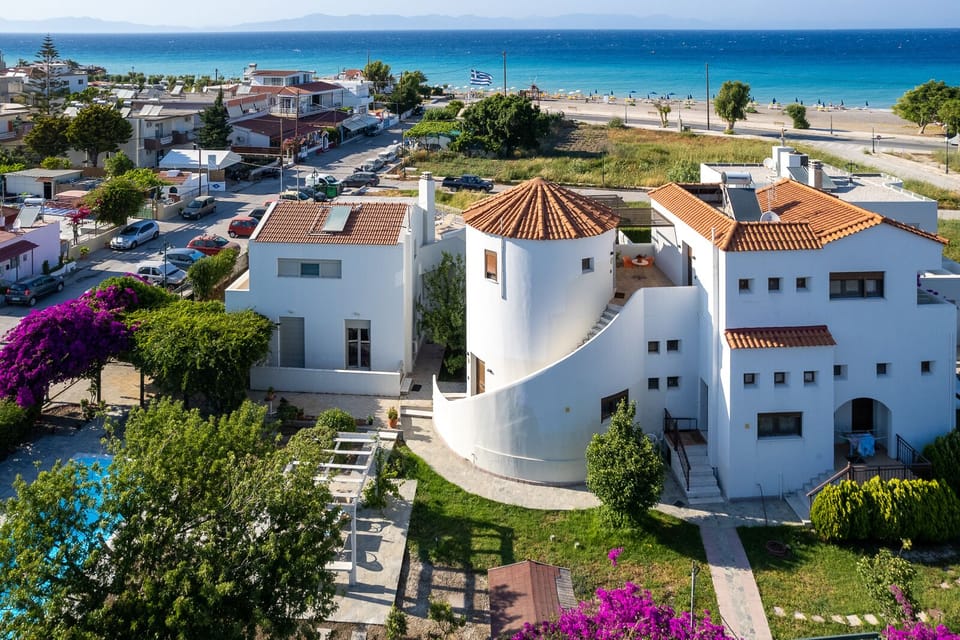 Villa Mylos and local beach aerial view