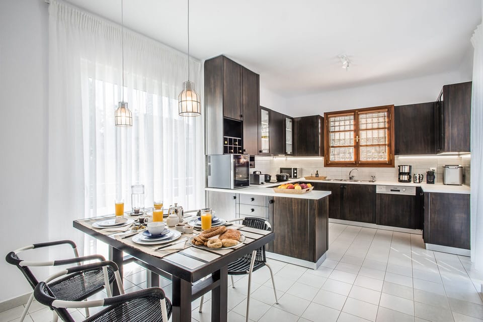 Kitchen on the first floor with a balcony and direct access to the swimming pool