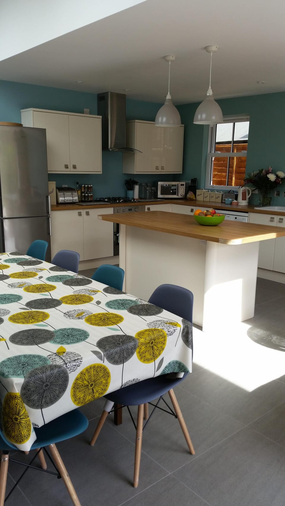 Large open plan kitchen/dining room with informal seating area 