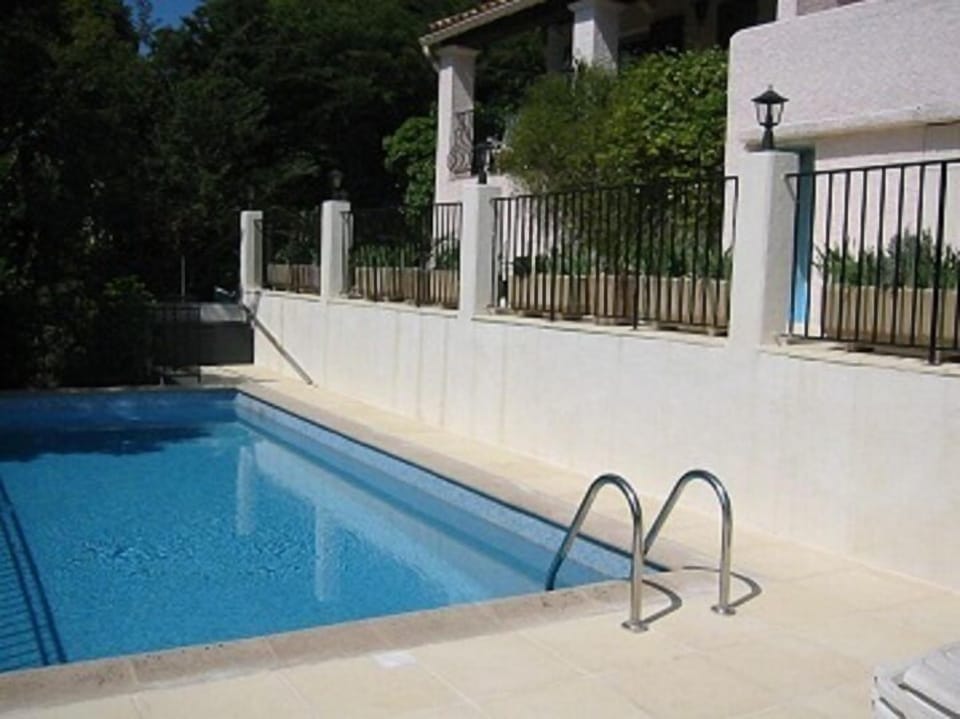Private and secluded swimming pool surrounded by sun terraces.