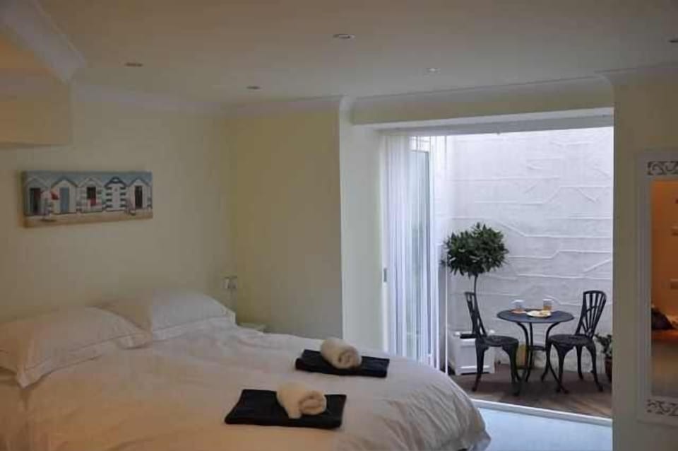 Master en-suite bedroom with secluded outside decking.
