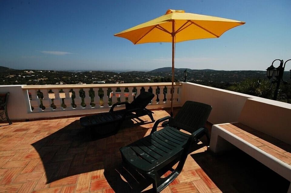 Pool terrace with the views in the background.