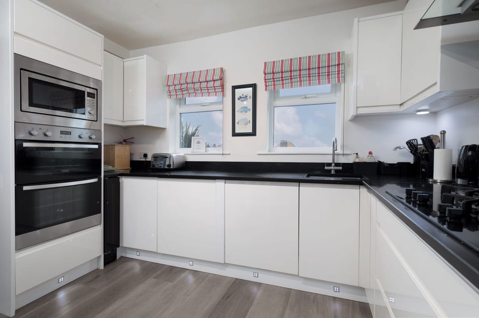 Well equipped kitchen with quartz worktops, wine cooler, toaster, kettle