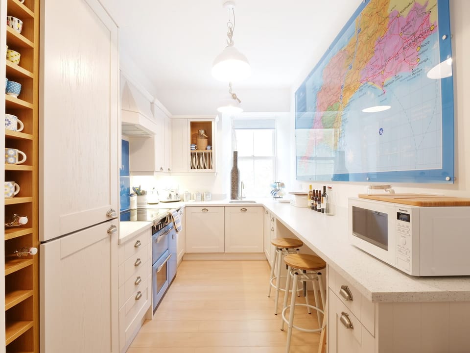The fab kitchen with breakfast bar to chat at whilst cooking or plan a Getaway!