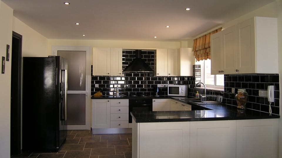 Designer kitchen with american style fridge freezer.