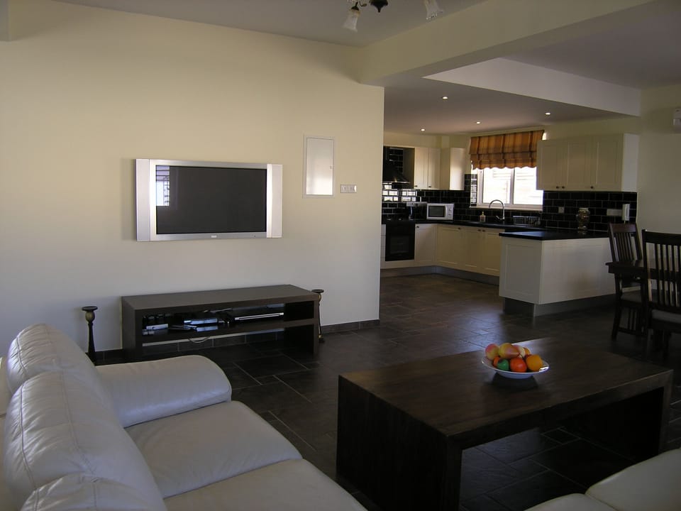 Open plan lounge leads to kitchen.