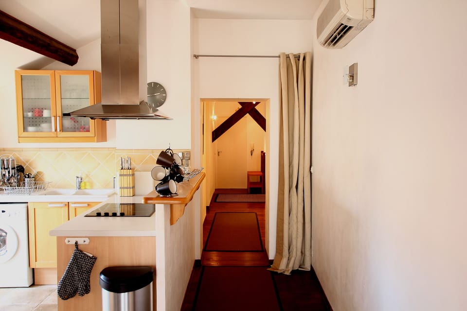 Looking from the lounge, past the American kitchen, to the bedroom