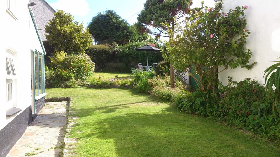 Private, enclosed garden with garden furniture