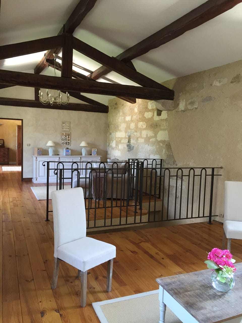 Upstairs reading / chill-out area, salon with staircase leading to gardens.