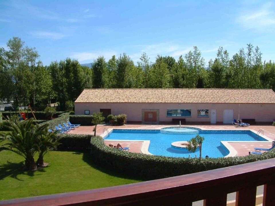 Swimming pool and pool house taken from from neighbouring apartment