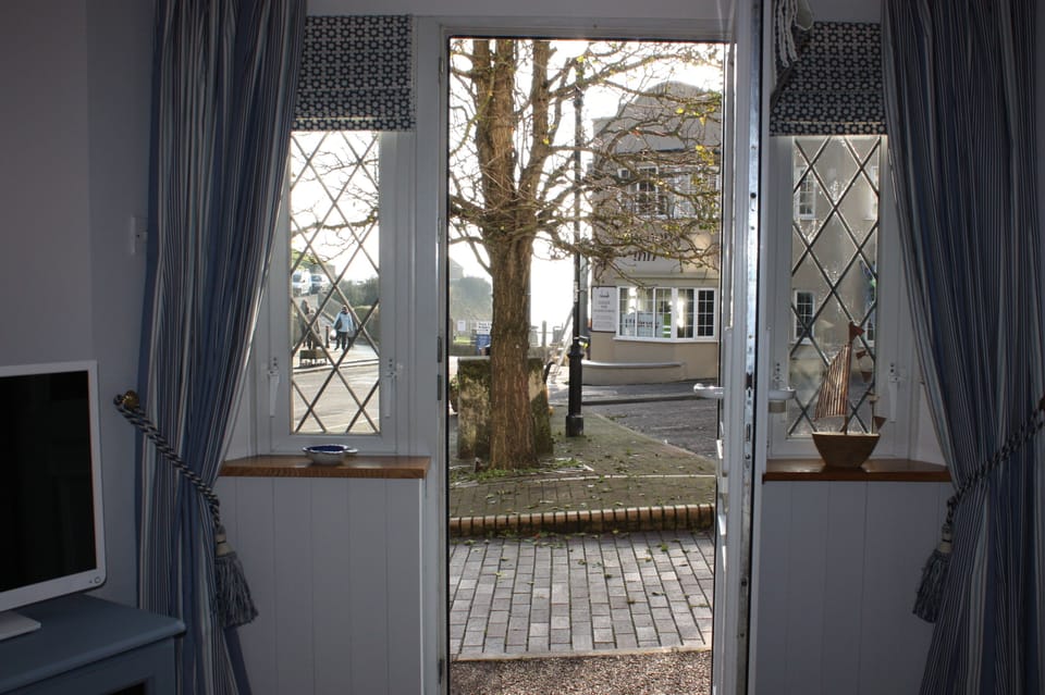 What a location!!! View from cottage towards beach, slipway & cliffside gardens