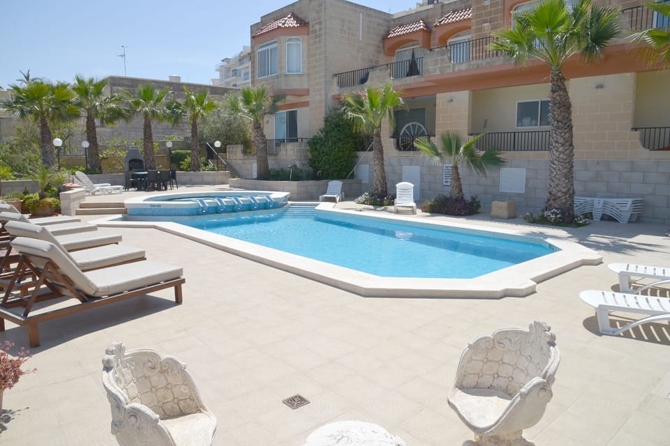 Pool area and villa