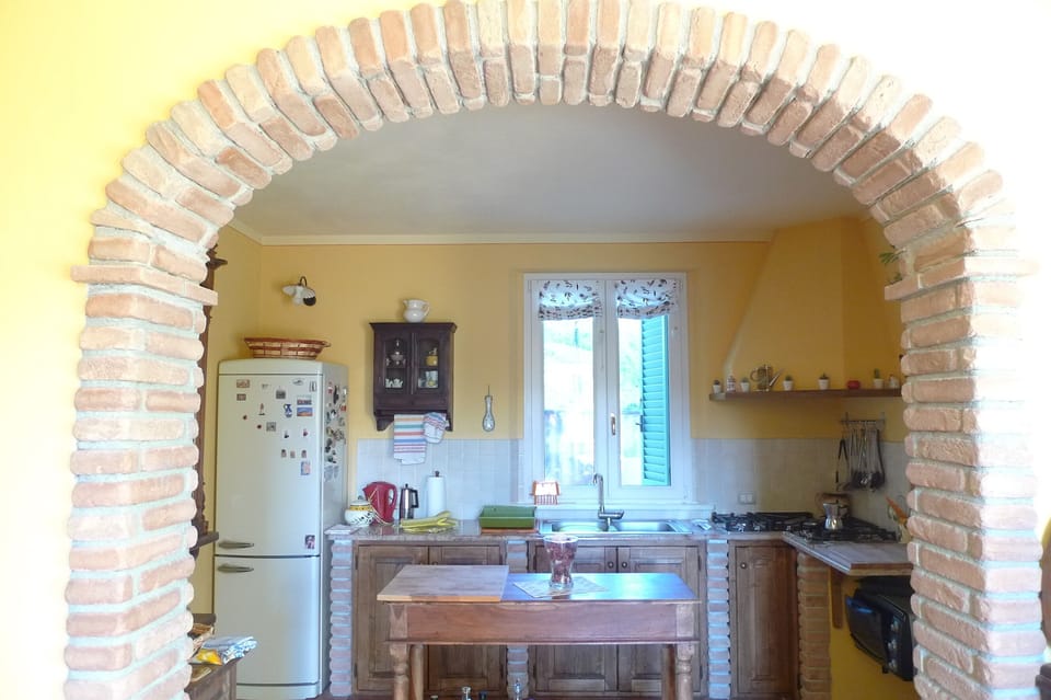 Archway to kitchen from dining area