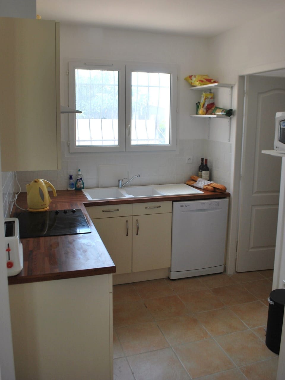 Kitchen, with utility room off. 