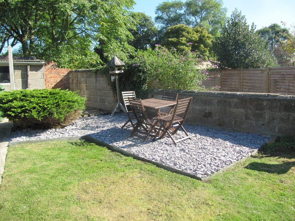 Back garden area with seating. 