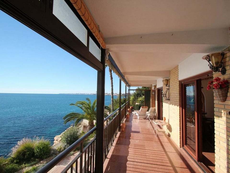 Large terrace with sunbeds, furniture at the seaside