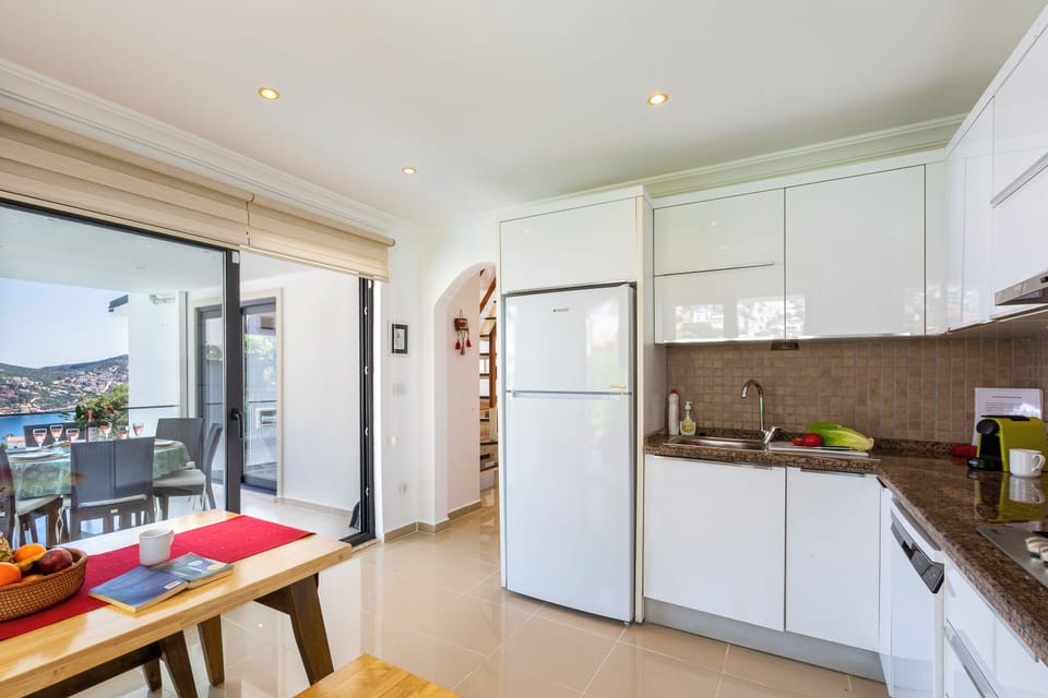 Kitchen with view towards kitchen balcony