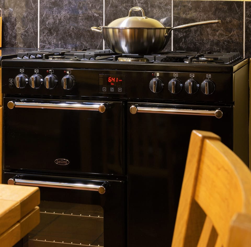 Range cooker with six gas hobs and two fan assisted ovens plus grill