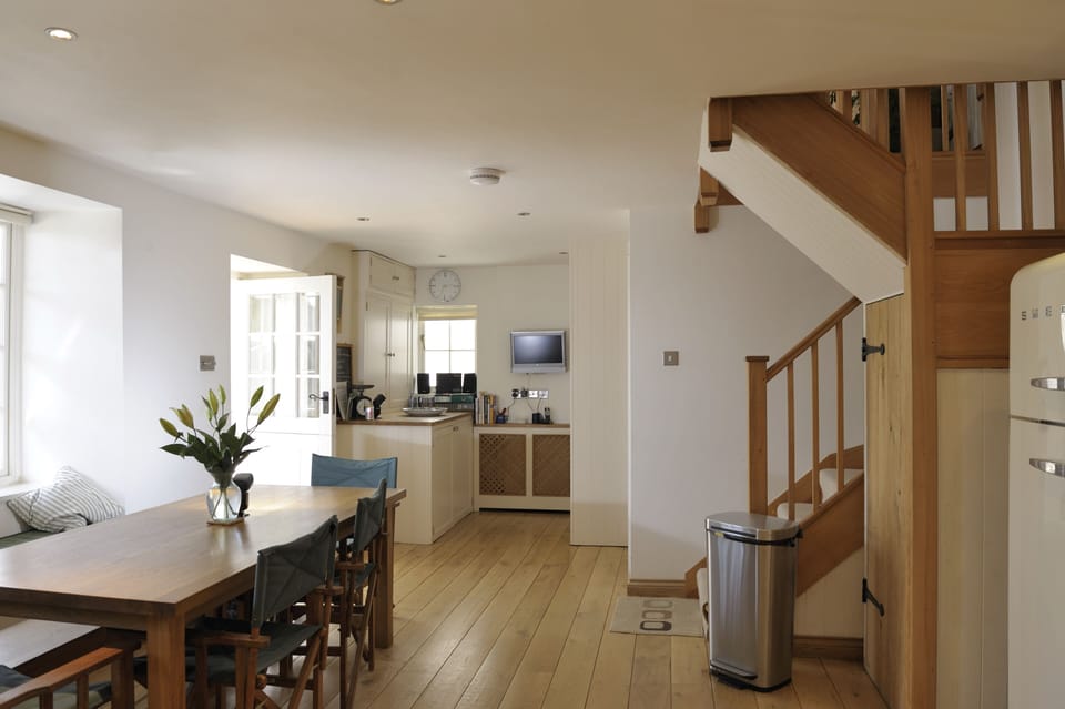 Kitchen and utility area with washing machine and tumble drier