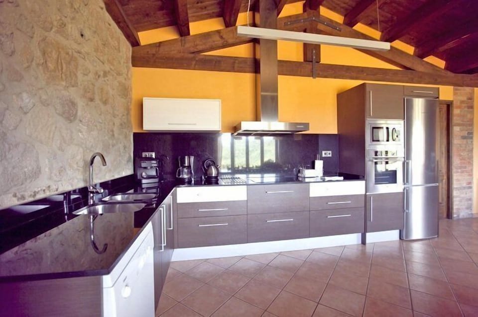 The newly build kitchen is very modern and has all amenities you will need