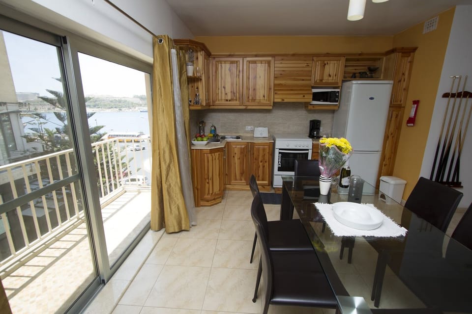 Kitchen, Dining, Balcony with seaviews of Sliema Ferry, Manoel Island & Valletta