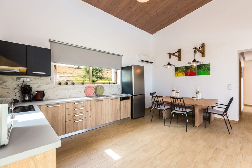 A wooden, modern designed, fully equipped kitchen is ready to welcome you!