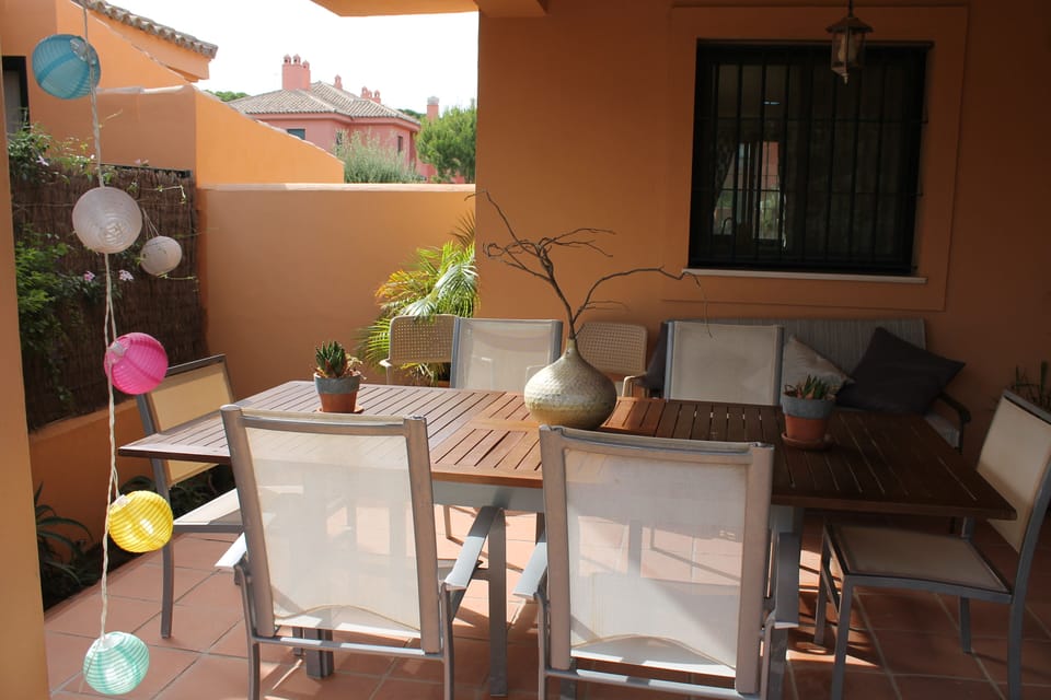 Outdoor terrace onto garden with large table seats 12