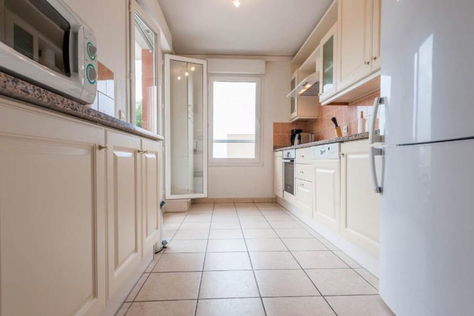 Kitchen from the hall, terrace doors open on the left