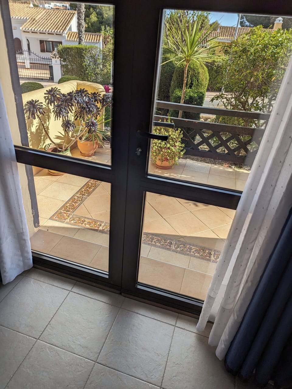 French doors open onto a pretty patio